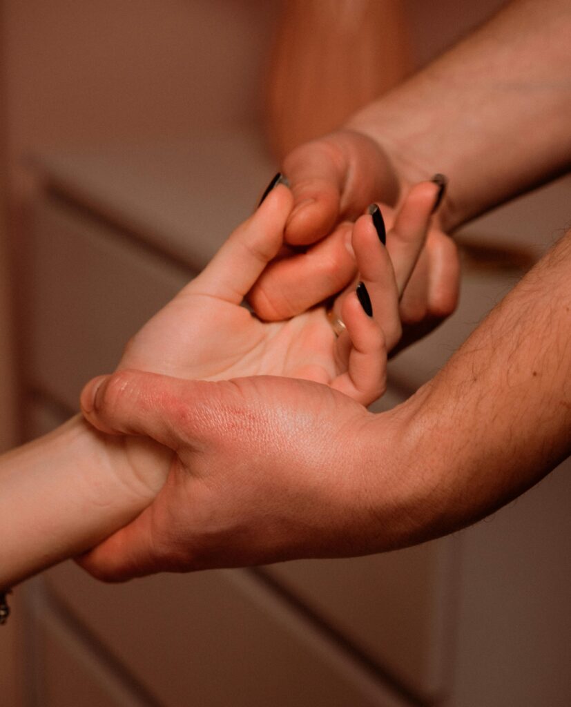 A heartfelt close-up image capturing hands gently holding, symbolizing connection and support.